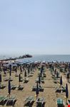 lignano sabbiadoro sandy beach with deck chairs and sunshades