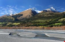 River flows under the mountains