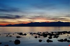 Rocks in water along lake shore