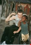 johannesburg wheelchair traveller ben with african village boy