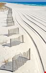 pensacola deserted beach with fresh track marks in sand