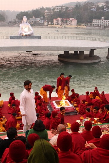 Students pray on the River Ganges