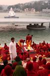 students pray on the river ganges rishikesh