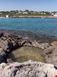 Piscine naturali a Cala di Binibequer