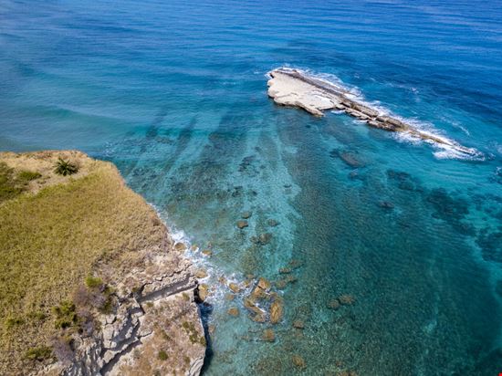 Spiaggia di S. Irene e Scoglio della Galera Spiaggia di S. Irene e Scoglio della Galera Naeblys - Shutterstock.com 