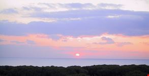 Tramonto sulla pineta di Baia Domizia